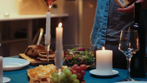 Close Up of Man Lighting the Candle alt