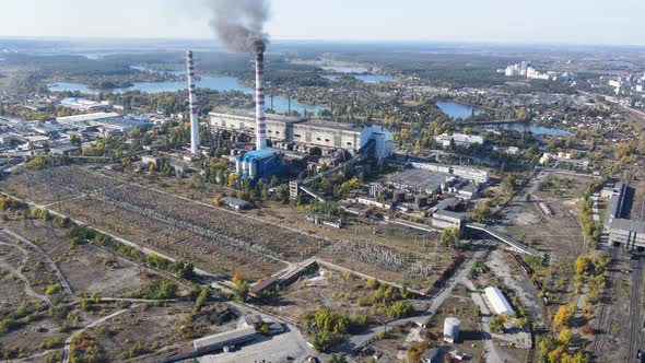 Aerial view of thermoelectric plant with big chimneys in a rural landscape in autumn, Trypillya
