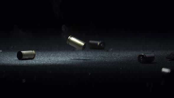 Sleeve Realistic Bullet Metal Slot on Dark Gray Asphalt Smoke Coming From the Bullets