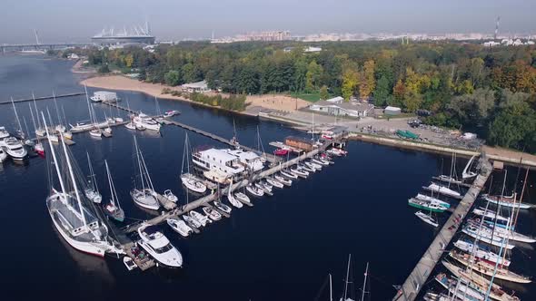 Large and Small Boats Stand on the Pier on a Summer Day Within the City  Drone alt