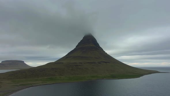 Kirkjufell Mountain in Summer and Cloudy Sky. Iceland. Aerial View alt