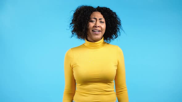 Pretty African Woman Showing Gesture of Nonsense Not Serious alt