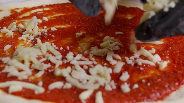 Close Up View of a Man Chef Cooking Italian Pizza. The Process of Making Pizza at Table . Fresh alt