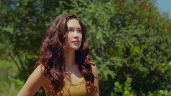 Relaxed Model Standing on Sunlight Closeup alt