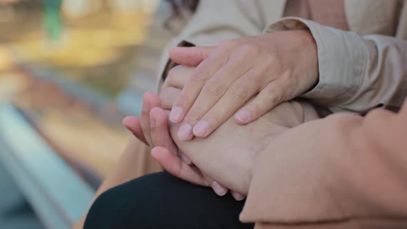 Close Up Young Couple in Love Hold Hands Sitting on Bench Unrecognizable Girl and Guy on Romantic alt