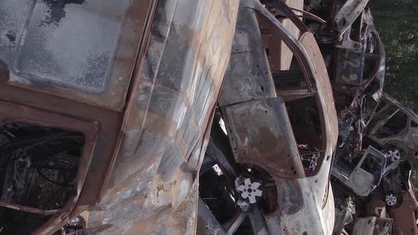 Vertical Video of Burned and Shot Cars During the War in Ukraine alt