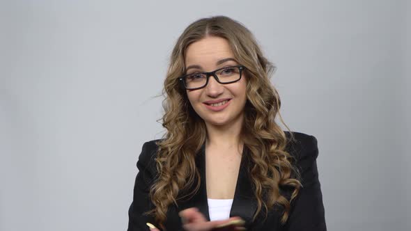 Bussines Woman in Glasses Waving Hand and Showing Gesture Come Here. alt