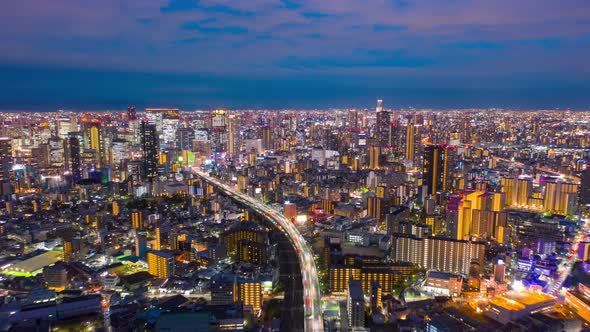 Aerial view Hyper lapse 4k footage of car on highway and Building alt