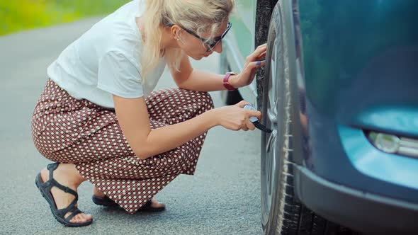 Frustrated Woman Repairing Flat Tire Check Pressure Accident Car. Broken Vehicle Damage Troubles. alt