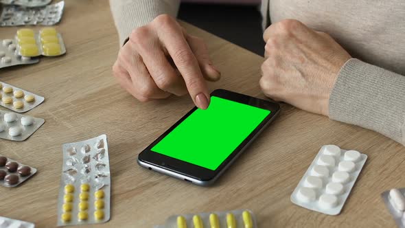 Grandmother Scrolling Smartphone App, Ordering Medicine Online, Green Screen alt