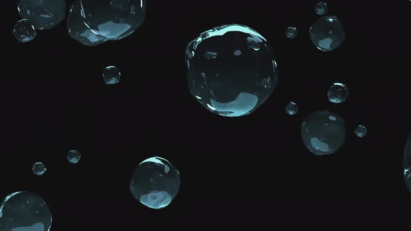 Large transparent drops of liquid slowly fall on a transparent background