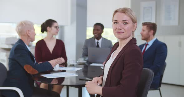 Group of Business People Having Discussion in Conference Room alt