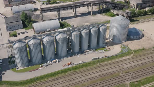 Modern Grain Silos Next to Railway
