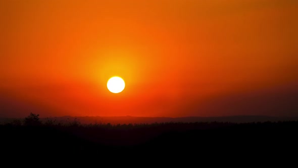 Timelapse Sunset in the Sky Big Bright Yellow Sun Moves Down on the Horizon alt