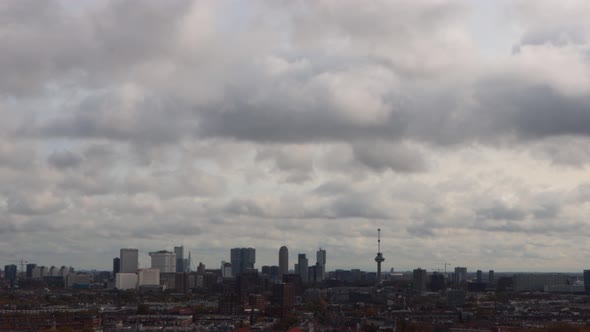Wide shot of skyline of Rotterdam, the Netherlands on a cloudy day alt
