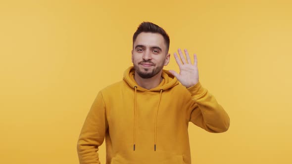 Expressive young man screaming and shouting over vibrant background. alt