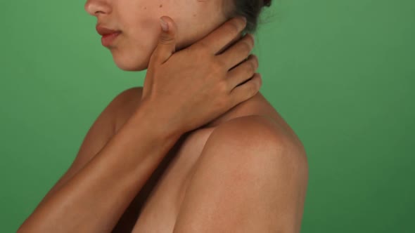 Young Woman Touching Her Shoulder alt