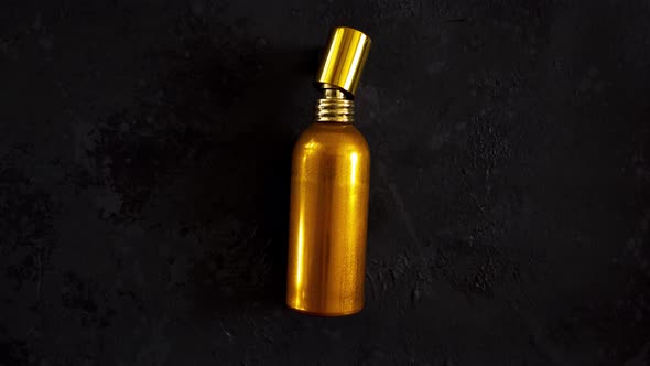 Stop Motion Animation with Perfume Spray Bottle and Natural Rose Flowers on Dark Background