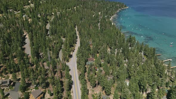 Cars Driving on Mountain Highway Road Through Jeffrey Pine Tree Forest alt