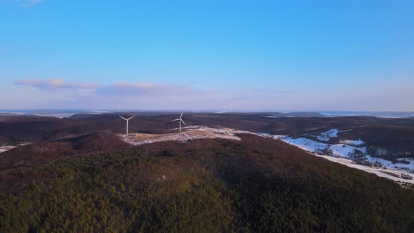 Aerial Drone View Wind Power Turbine on the Horizon Green Energy Concept