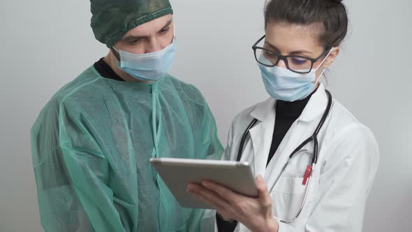 Medical Team with Protective Clothes and Masks Working on Positive Coronavirus Tests alt