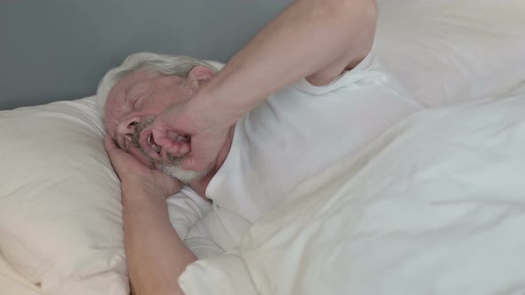 Old Man Waking Up From Sleep in Bed  alt
