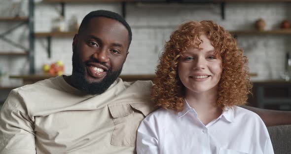 Portrait of Adorable Loving Interracial Couple Embracing Each Other Cute Smiling with Toothy Smile alt