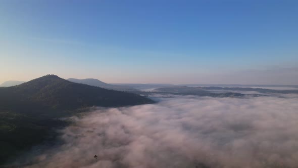 4K Drone Flying in the clouds. Flying through the clouds during sunrise alt