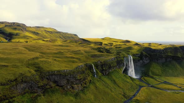 Flying Towards the Seljalandsfoss Waterfall in Iceland alt