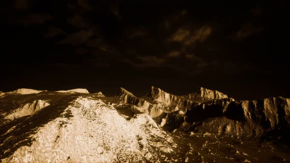 Dark Clouds Over Volcanic Valley with Grass and Rocks alt