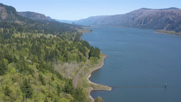 Aerial reveal of scenic nature and the Columbia River dividing The state of Washington and Oregon. alt