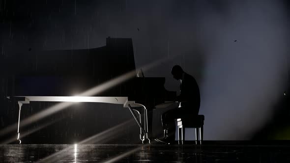 The Man Playing the Piano in the Fog