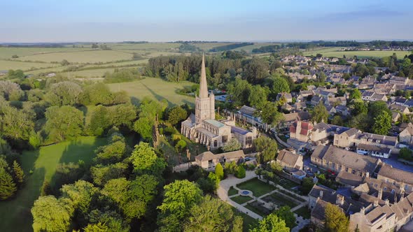 Aerial Drone View of Cotswolds Village and Burford Church in England, a Popular English Picturesque alt