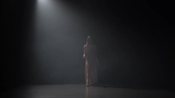 Motion of a Sexy Lady Practicing Contemp in Dark Studio. alt