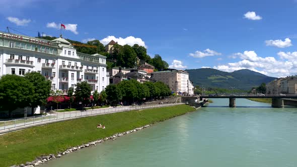 Panning shot of beautiful cityscape with Salzach river and castle in Salzburg,4k alt