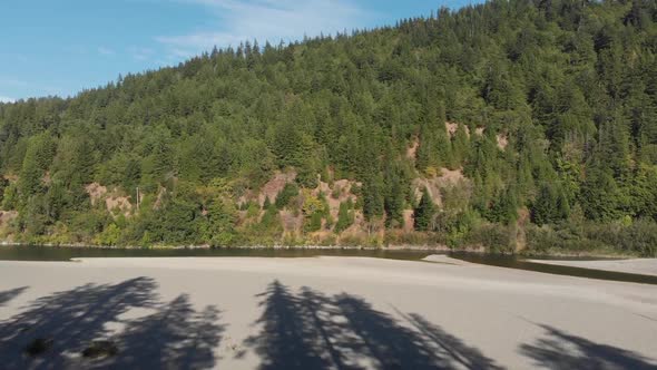 Rising aerial view of the South Fork Eel river in Humboldt County, California.  Redwood forest alt