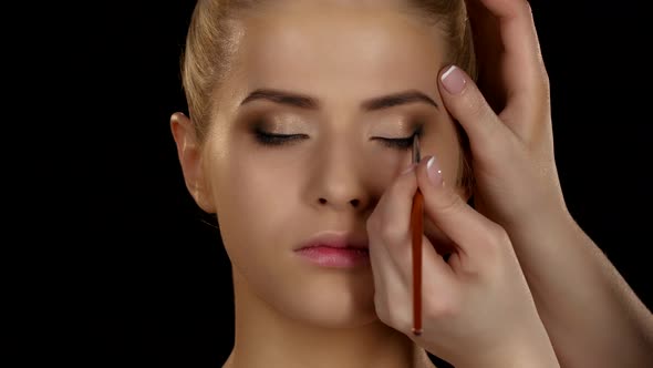 Professional Make-up, Side View of Eyeshadow Application with Brush alt
