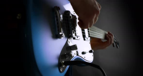 Male Guitarist Plug in Electric Guitar