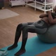 Athletic black woman doing morning fitness workout in living room