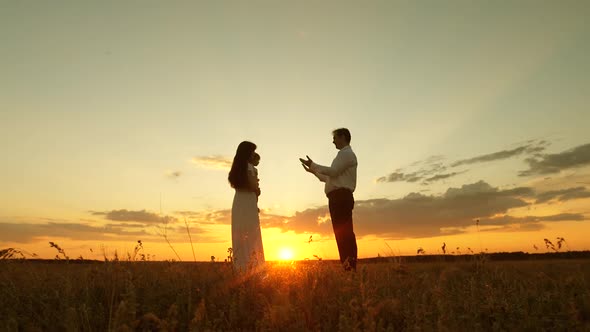 Daughter Plays with Mom and Dad in the Sun alt