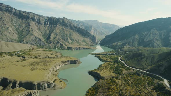 Beautiful valley with mountain quiet river and rocks alt