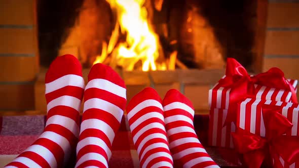 Family in Christmas Socks near Fireplace
