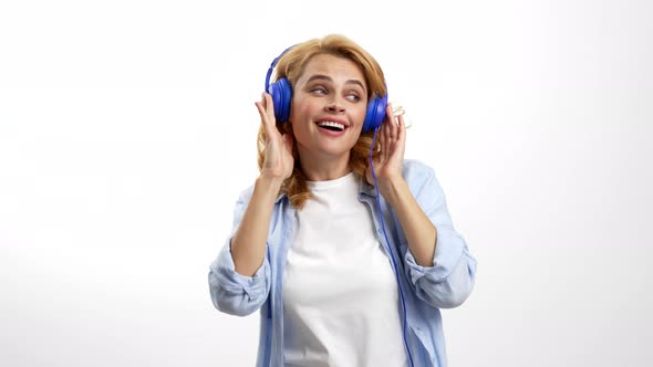 Happy Dancing Woman Enjoying Music in Dj Headphones Relax