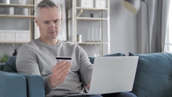 Online Shopping on Laptop By Casual Gray Hair Man Online Banking alt