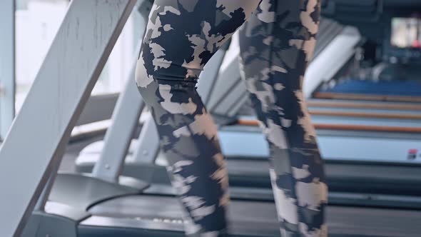 Woman Working Out and Jogging on Treadmill