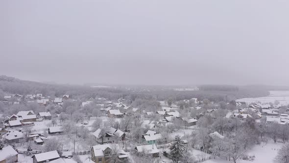 The Empty Private Properties in the Suburbs on a Idyllic Snowy Winter Day Aerial View alt