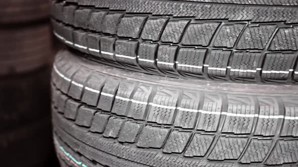 Tire for cars close-up. Tires lie on top of each other in several pieces.