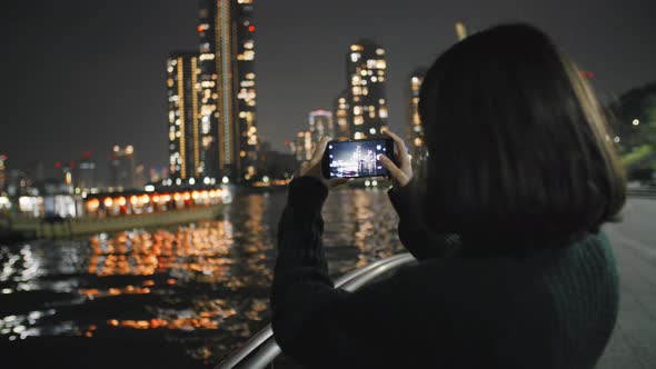Girl With Smartphone At Night
