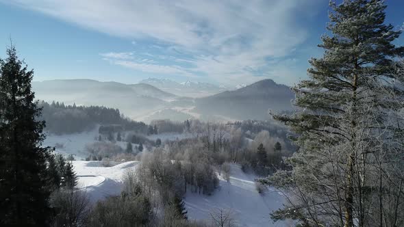 Aerial view of mountain winter ski resort and amazing winter alpine scenery