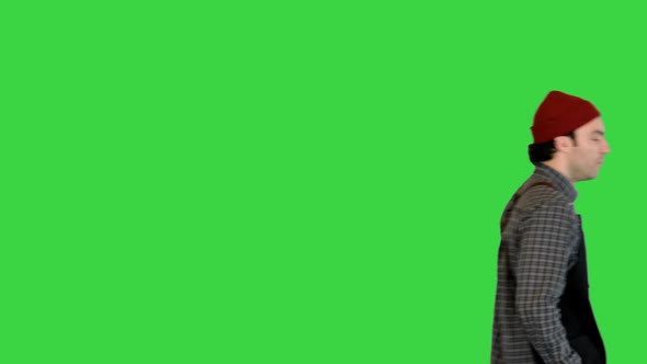 Handyman Walks After Workday Wiping His Hands on a Green Screen Chroma Key alt